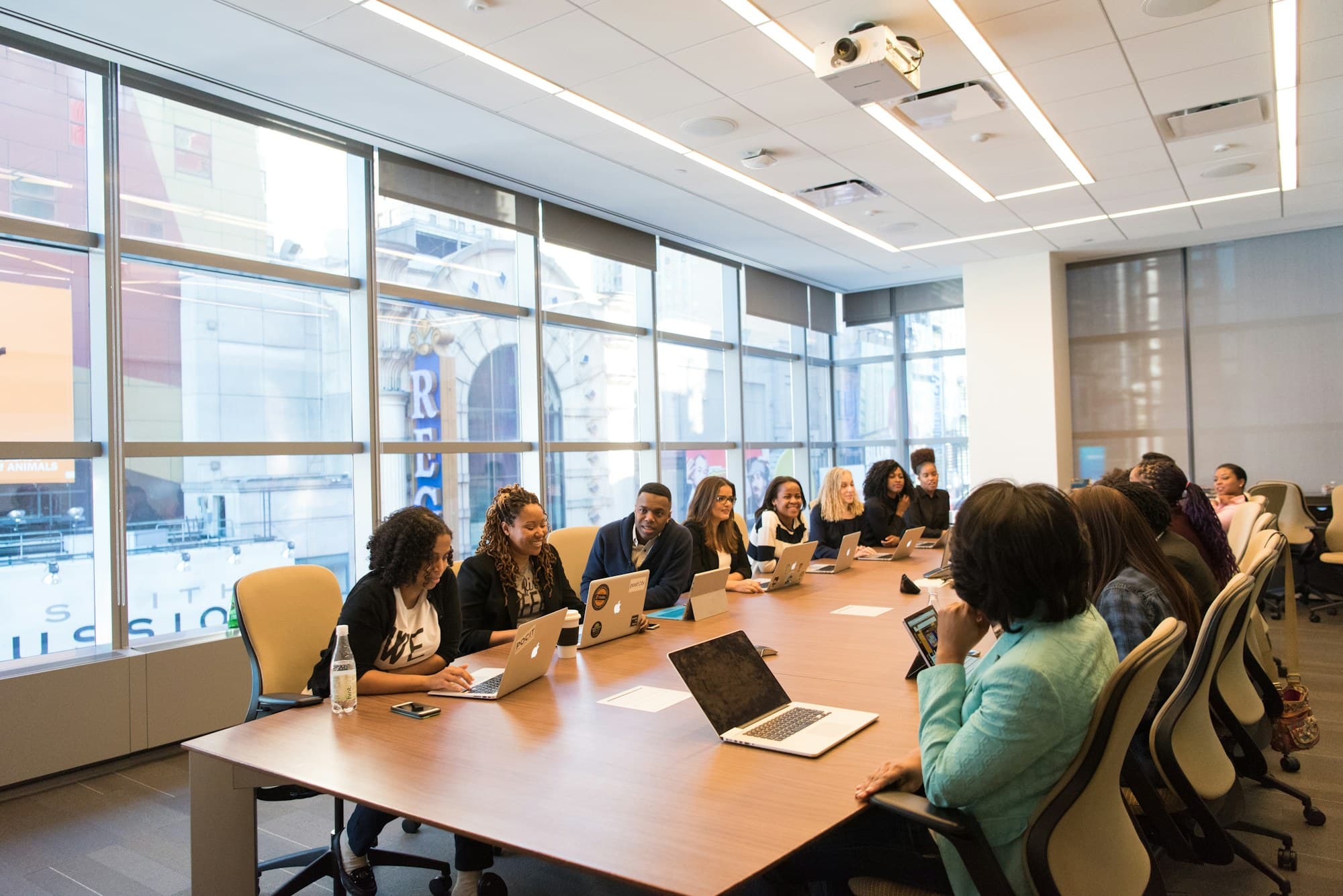 Black professionals collaborating around a conference table