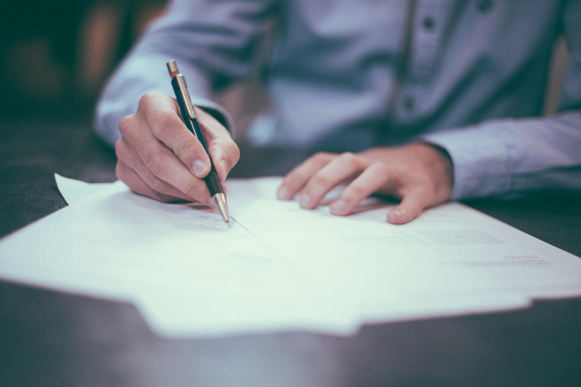 Documents and notes on a professional workspace